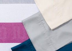 Three colour options of Juno Bamboo Sheets: Navy, Light Grey, and Oatmeal