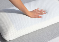 Hand pressing in to the surface of a Juno Cooling Gel Pillow