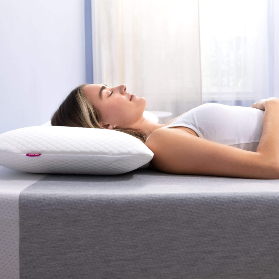 Woman sleeping on her back with a Juno Cooling Gel Pillow