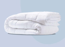 Juno Down Alternative Duvet – folded on a blue background