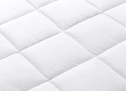 A close up view of the Juno down alternative duvet that shows the individually quilted chambers that allow for the duvet filling to be evenly distributed.