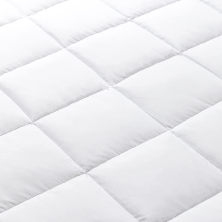 A close up view of the Juno down alternative duvet that shows the individually quilted chambers that allow for the duvet filling to be evenly distributed.