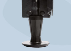 A close-up of one of the Juno metal bed frame legs with a rubberized foot.