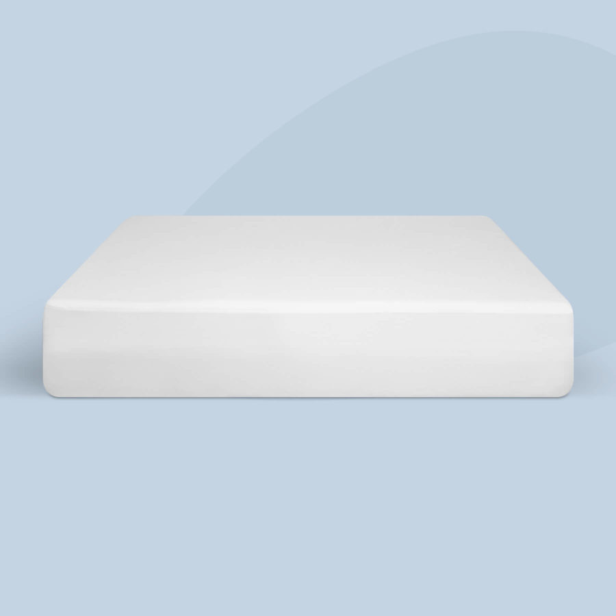 A Juno mattress protector is stretched over a Juno mattress.