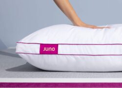 Hand pressing into a Juno Adjustable Memory Foam Pillow