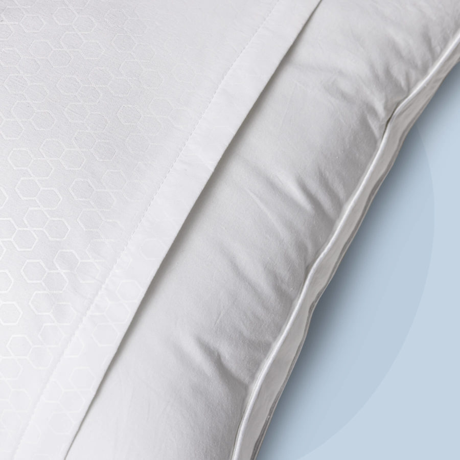 A close up of the opening where a pillow is placed inside the Juno Pillow Protector.