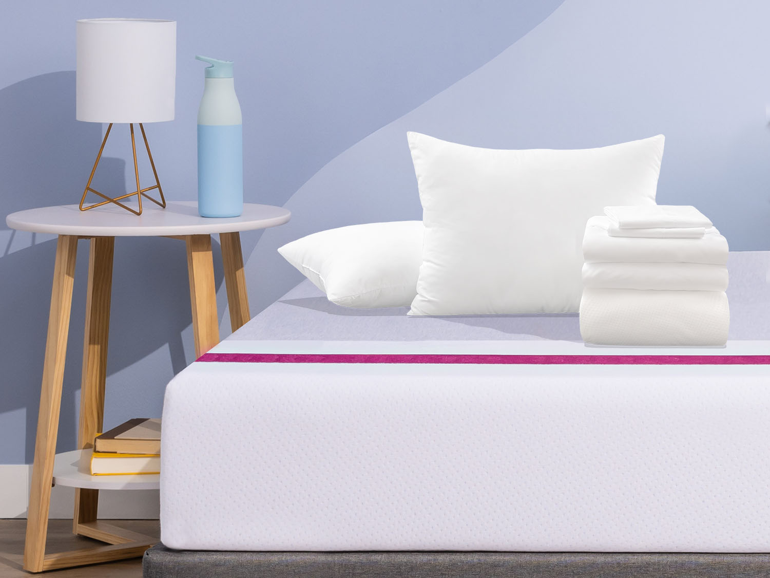 Value Sleep Bundle items on top of a Juno mattress