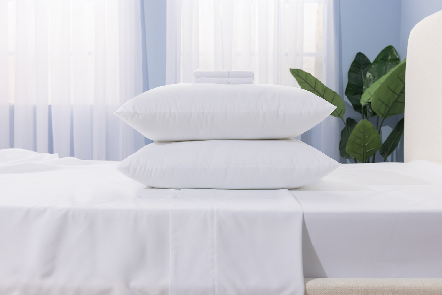 Value Bundle Microfibre Pillows on top of a Juno mattress