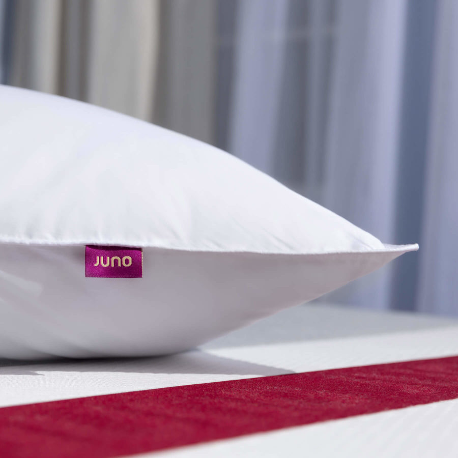Close-up of the side and tag of a Juno Down Alternative Pillow